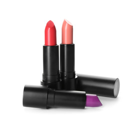 Colourful lipsticks on white background