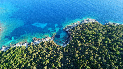 Aerial drone bird's eye view photo of iconic paradise sandy beaches with turquoise sea in complex islands of Agios Nikolaos and Mourtos in Sivota area, Ionian sea, Epirus, Greece