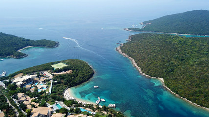 Aerial drone bird's eye view photo of iconic paradise sandy beaches with turquoise sea in complex islands of Agios Nikolaos and Mourtos in Sivota area, Ionian sea, Epirus, Greece