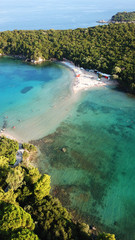 Aerial drone bird's eye view photo of iconic paradise sandy beaches with turquoise sea in complex islands of Agios Nikolaos and Mourtos in Sivota area, Ionian sea, Epirus, Greece