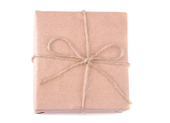 Mail package. Box packed in craft paper on a white isolated background. mail concept or delivery