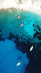 Aerial drone photo of tropical caribbean bay with white sand beach and beautiful turquoise and sapphire clear ocean sea