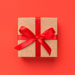 Wrapped vintage gift box with red ribbon bow