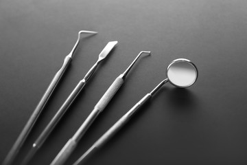Dentist's tools on dark background