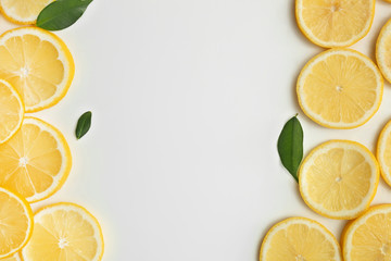 Composition with lemon slices and space for text on white background