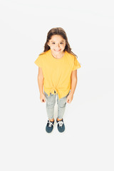 high angle view of adorable happy kid smiling at camera isolated on white