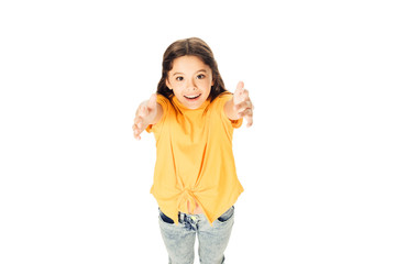 high angle view of adorable happy kid reaching hands and smiling at camera isolated on white