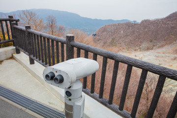 Telescope to observe the View of mountain at owakudani, sulfur quarry in Hakone