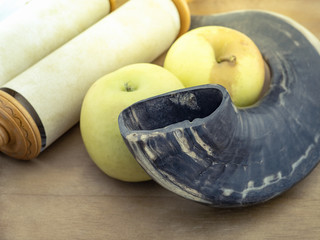 Scrolls of the torah, horn and Apple on a wooden table. Rendering.