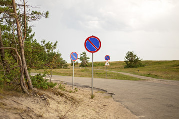 Prohibition signs for cars standing near the seashore