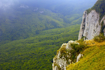 Landscape mountains. Beautiful view of the mountains from a height. Green mountains, fog and natural landscape. Fog in the mountains. 