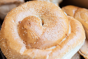 Breads and baked goods close-up. Fresh challah bread for shabbat. Bakery bread roll, bun background.