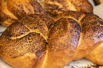 Breads and baked goods close-up. Fresh challah bread for shabbat. Bakery bread bun background.