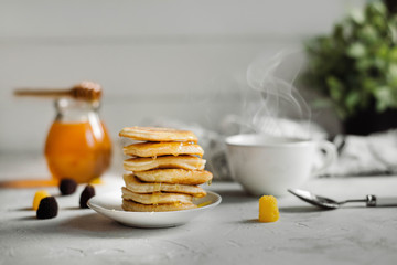 Pancakes with honey and a Cup of tea