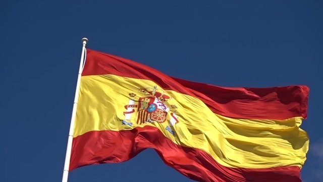 Close up of Spain flag slow waving on wind