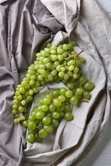 Ripe sweet grapes on table, top view