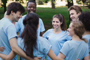 Meeting of young volunteers team in park