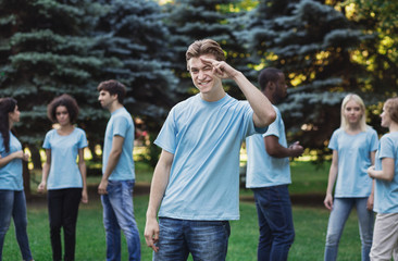 Meeting of young volunteers team in park