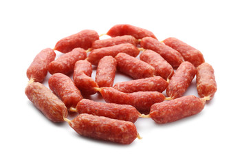 Delicious smoked sausages on white background