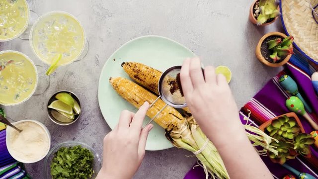 Time lapse. Step by step. Making Mexican corn on the cob Elote