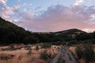 Hiking Trail through the Mountains at Sunset