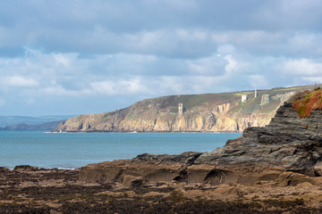 Landscape of south Cornwall from Porthleven looking north with sunlight playing across the rock formations