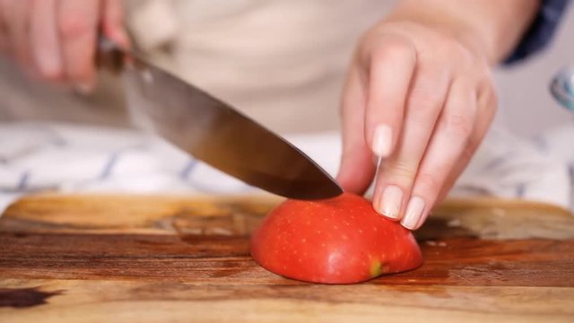 Step by step. Slicing red apples for filling to make empanadas