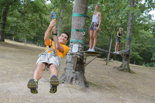 man on a rope climbing in the adventure park