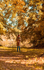Obraz premium woman with umbrella enjoying in nature.