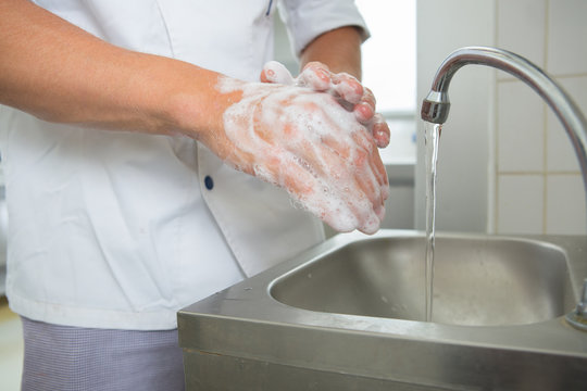 kitchen chef washing hands in the kitchen