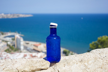 water in a bottle, a magnificent view at the sea, Spain of Alicante