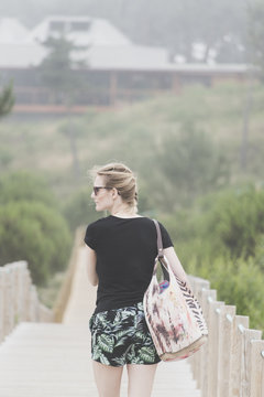 Portugal, Viana do Castelo , back view of tourist on footbridge