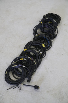 rolled up cables on a floor