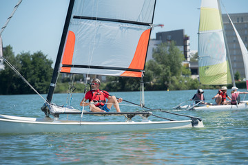 mature man enjoying hobie cat session