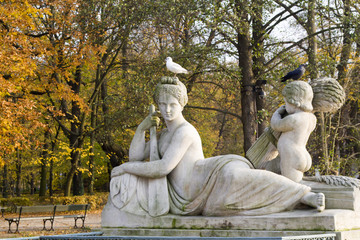 Monuments near lake in national Warsaw park Lazenki Krolewski, Kings bath.