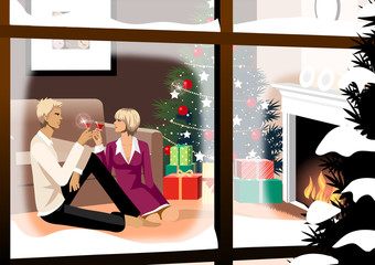 Couple toasting with glasses of red wine near a Christmas tree