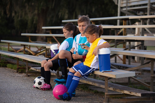 Soccer players taking a snack break.