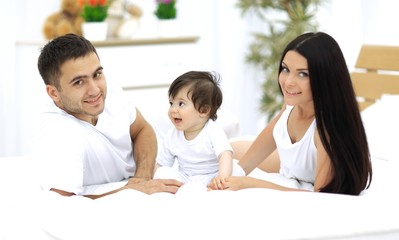 A young family with young children to bed in the bedroom