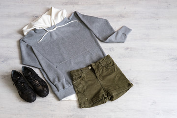 Teen clothing set: grey sweatshirt, green shorts and boots in military style