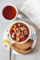 Vegetable sauté with eggplant, red pepper and tomatoes, and toasted rye bread
