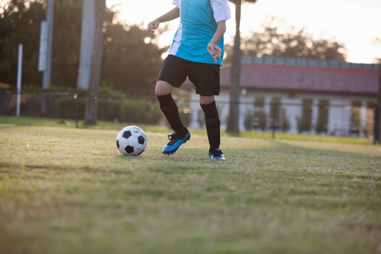 Soccer players practicing on a field.