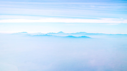 mountains among the cloud. panorama of mountain peaks covered by cloud. nature background