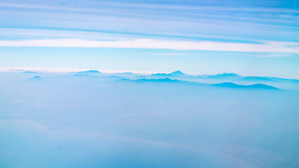 mountains among the cloud. panorama of mountain peaks covered by cloud. nature background