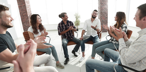 creative team holds a meeting in the lobby