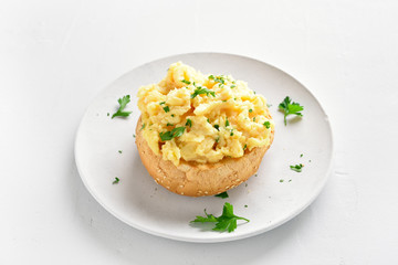 Scrambled eggs on bun