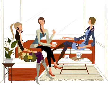Three women sitting on a couch