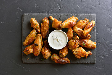 Grilled chicken wings with sauce © voltan