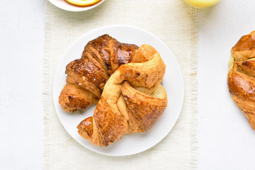 Croissants on plate, top view