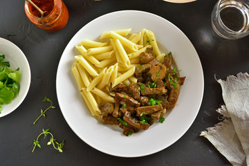 Beef stroganoff with mushrooms and pasta