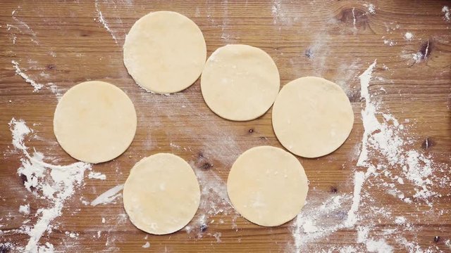 Flat lay. Step by step. Rolling dough for home made empanadas